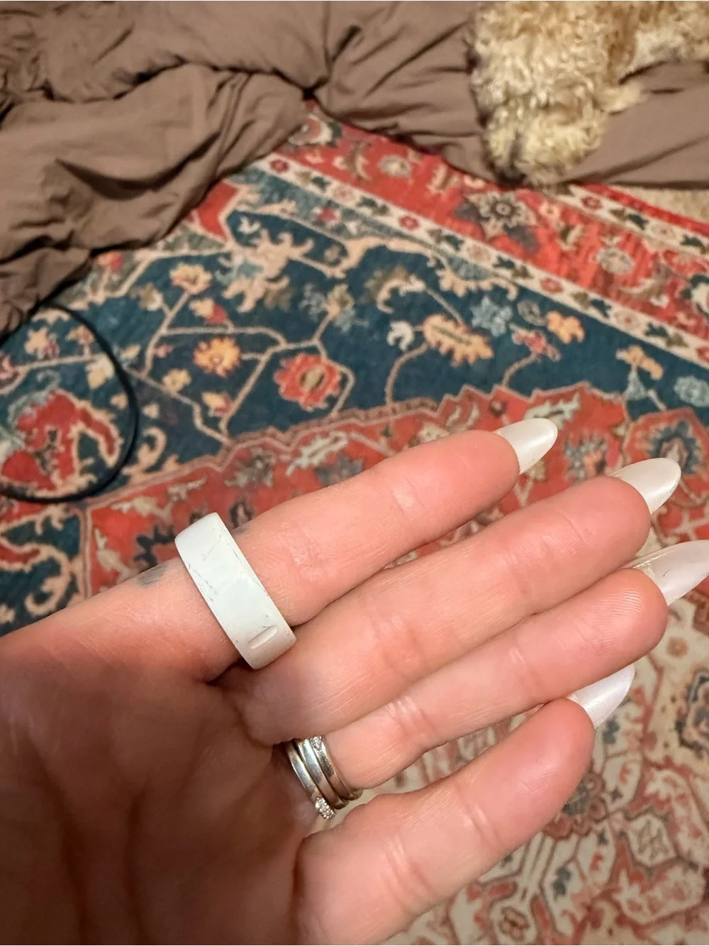 Oura Silver Smart Ring with White Charging Pad and Gray Cable